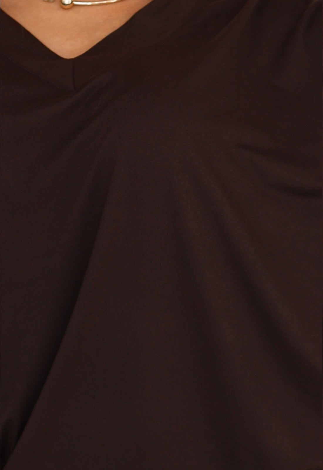Close-up of a dark brown fabric texture
