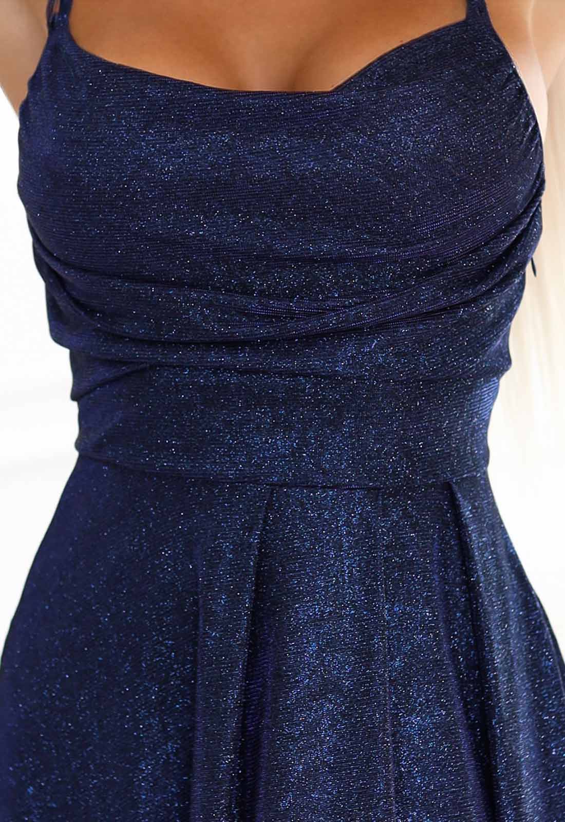 Navy blue sparkly dress with a fitted bodice and flared skirt.