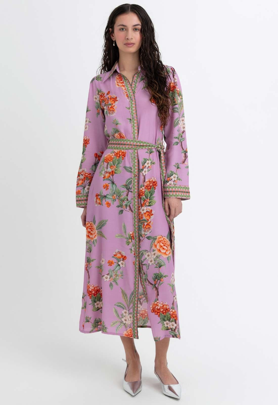 Woman wearing a floral dress with a white background