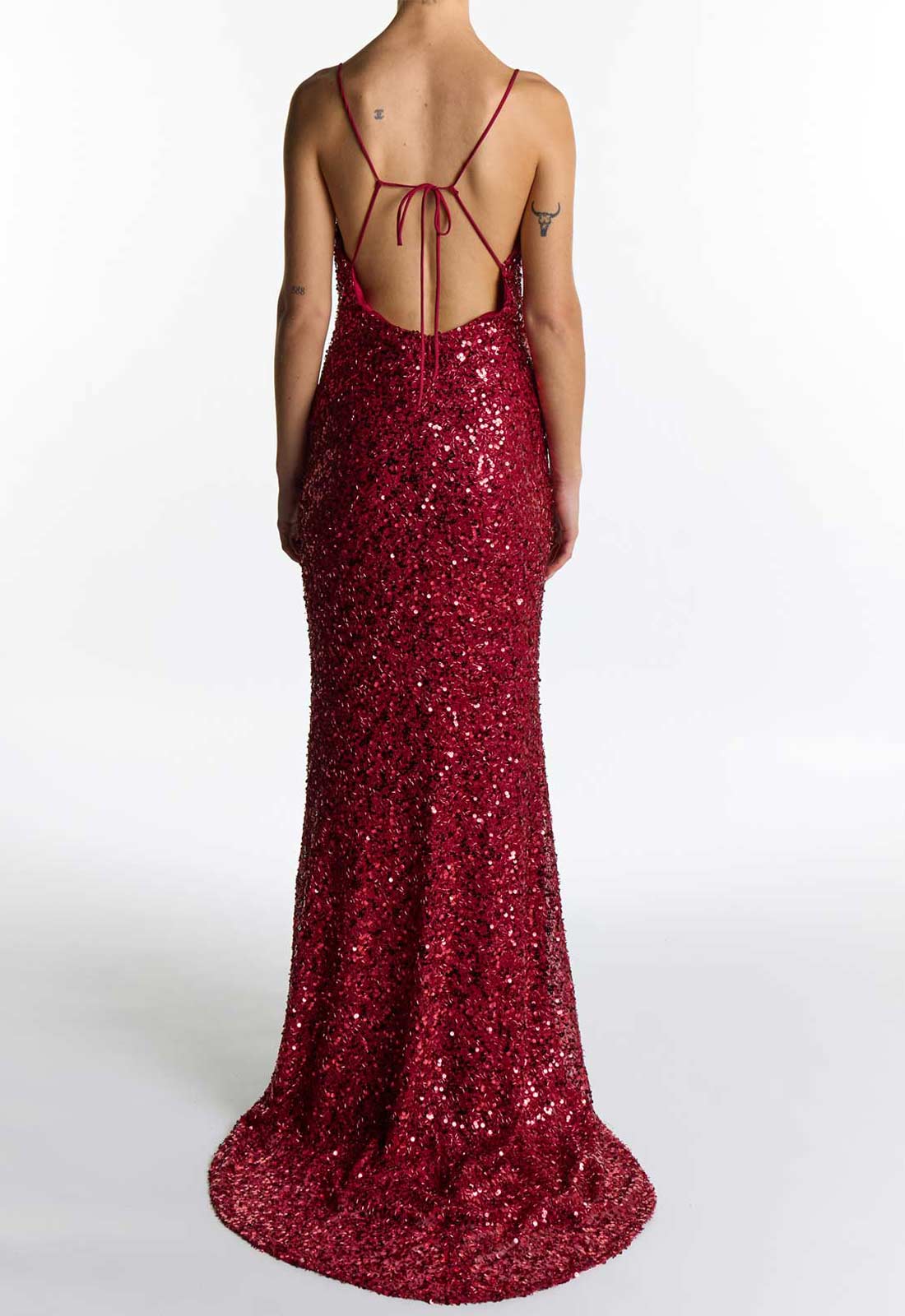 Burgundy sequin dress with thin straps on a white background