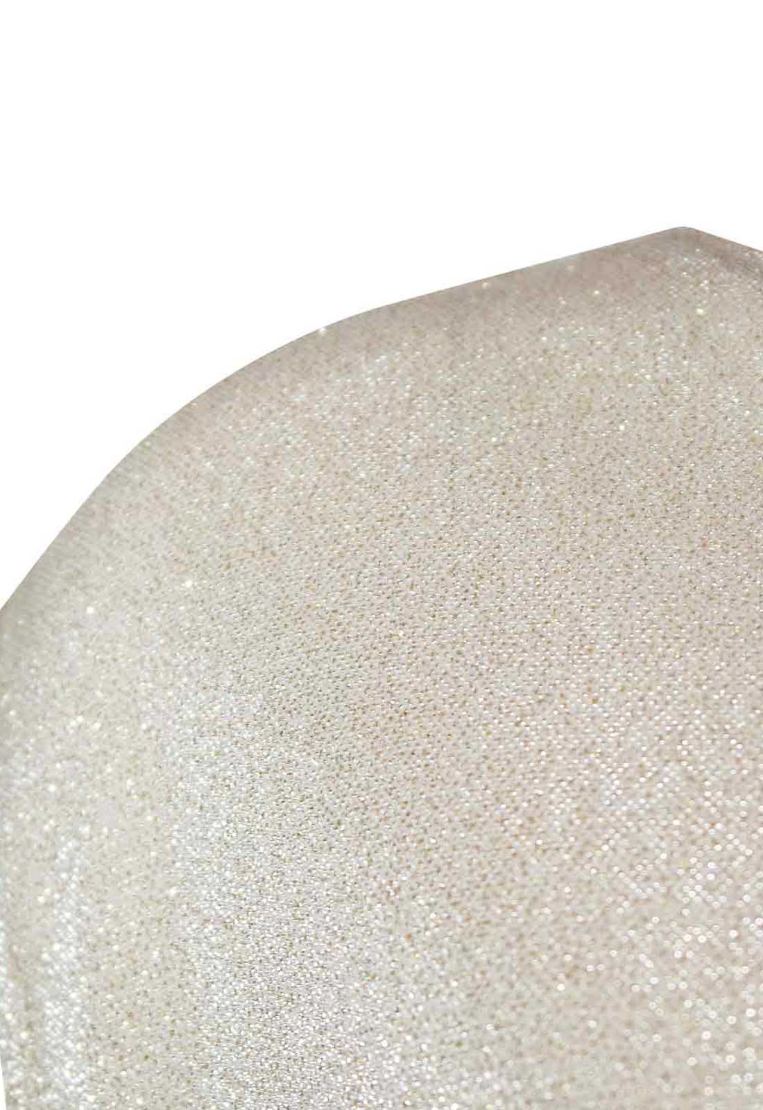 Close-up of a textured beige surface with a white background
