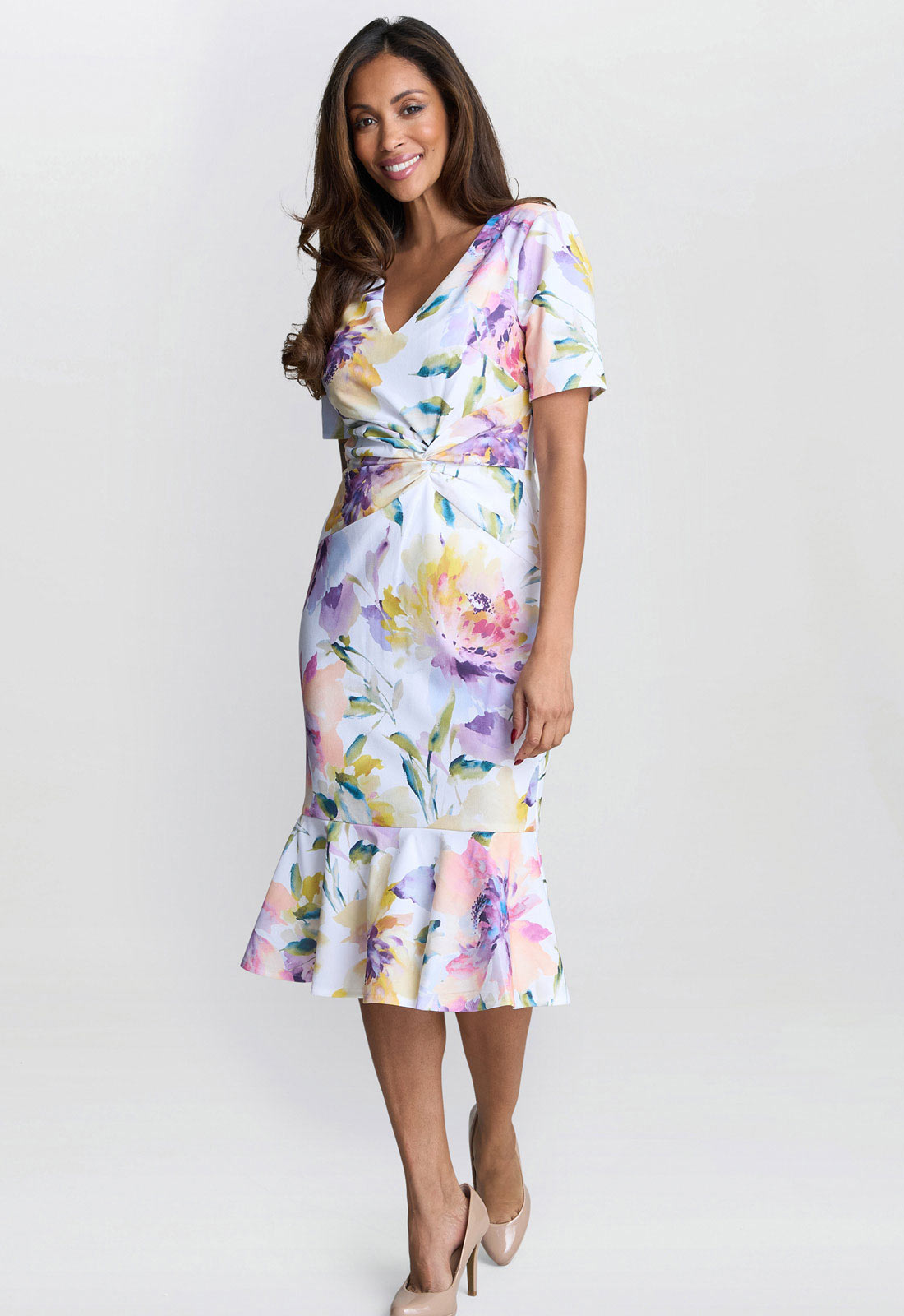 Woman wearing a floral dress on a white background