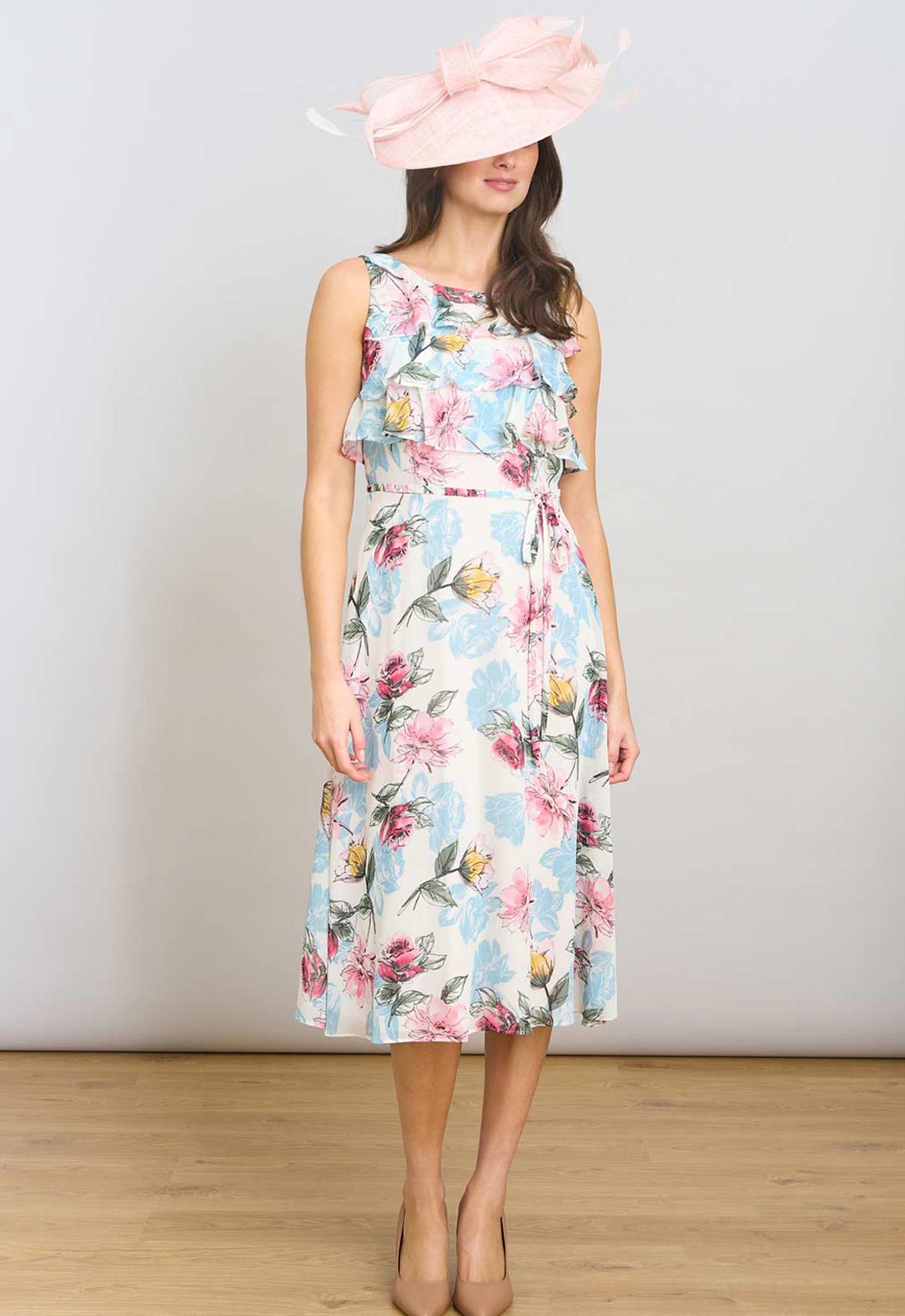 Woman wearing a floral dress with a white background