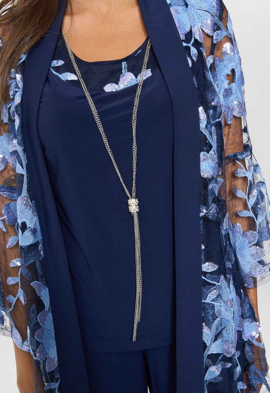 Navy blue outfit with floral cardigan and long necklace