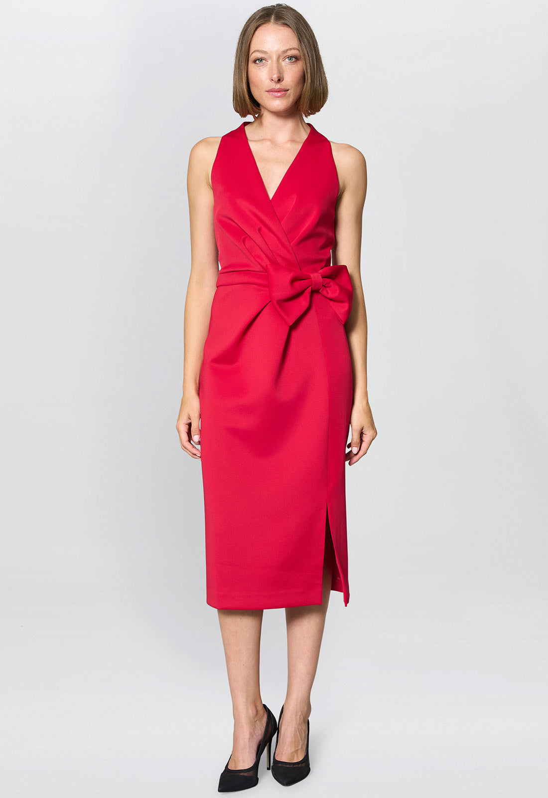 Woman wearing a red dress with a white background