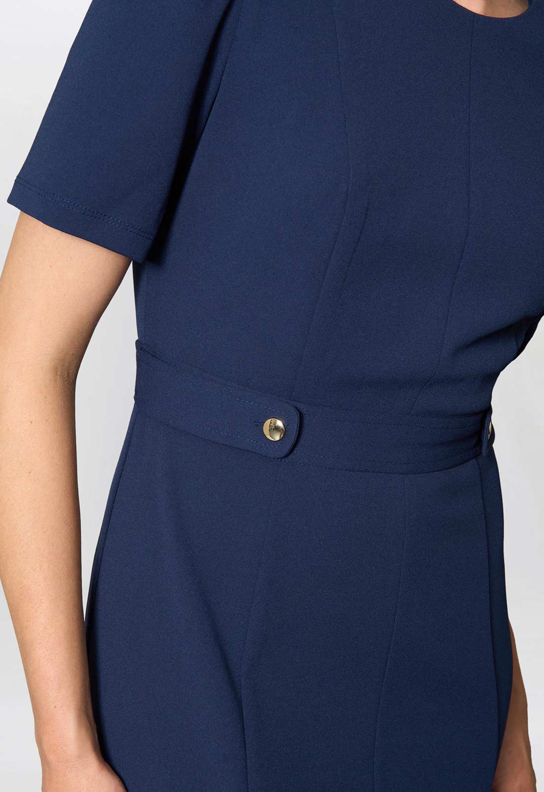 Navy blue dress with a button detail on a white background