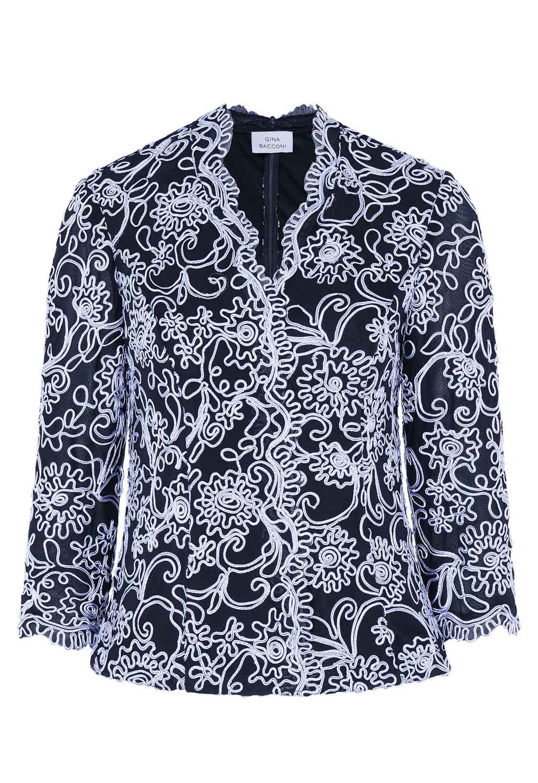 Black lace top with white floral patterns on a white background