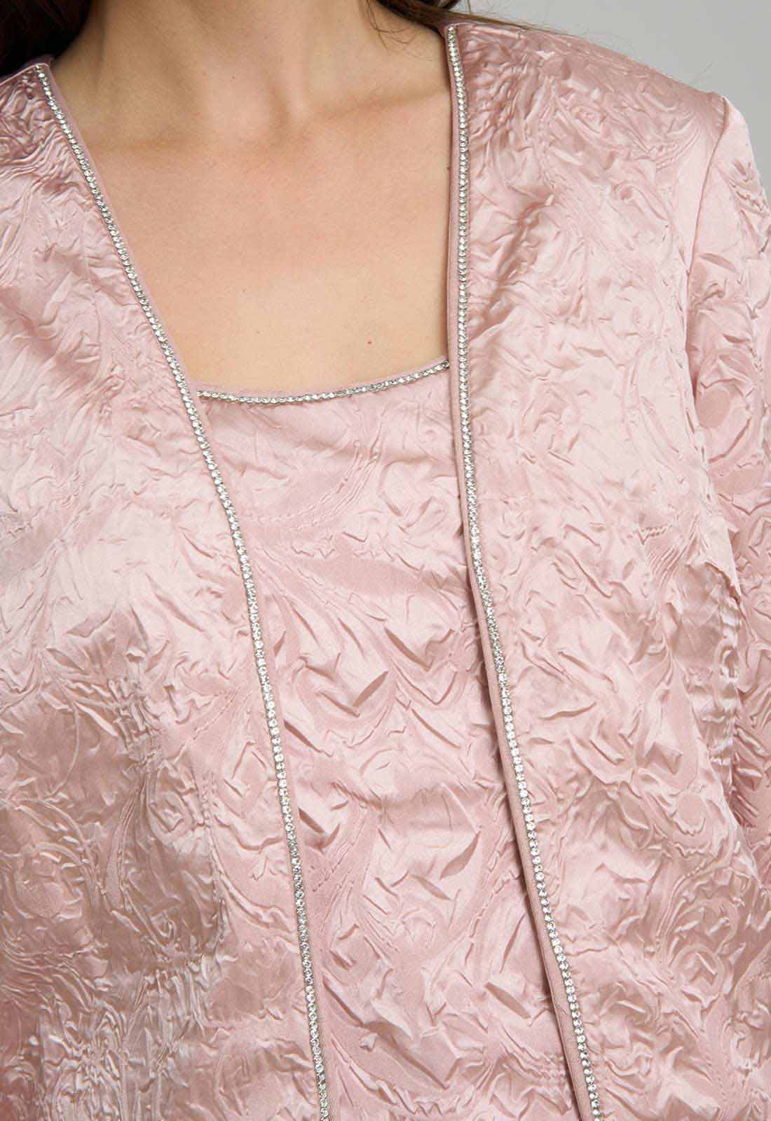 Close-up of a textured pink garment with a subtle pattern