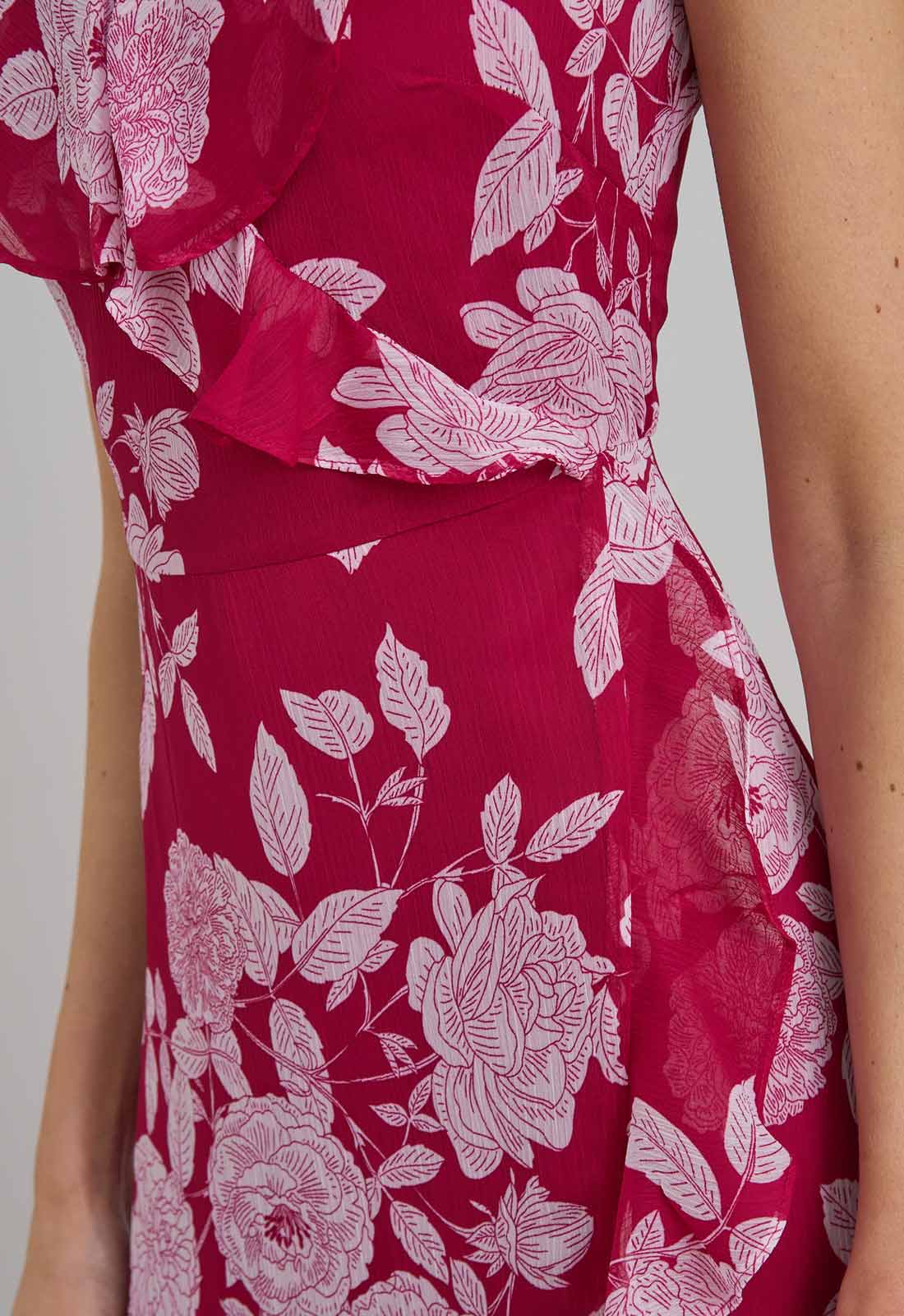 Red dress with white floral pattern on a plain background