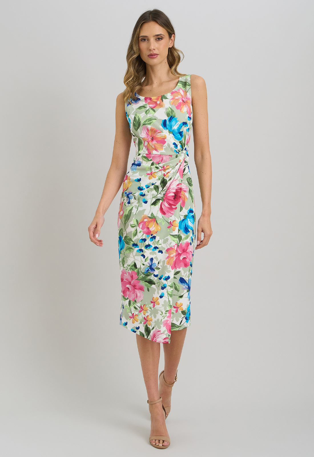Woman wearing a floral dress on a plain background