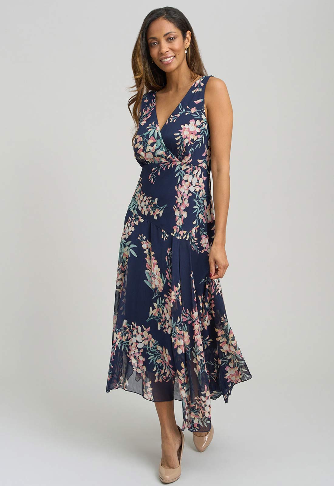 Woman wearing a floral dress on a white background