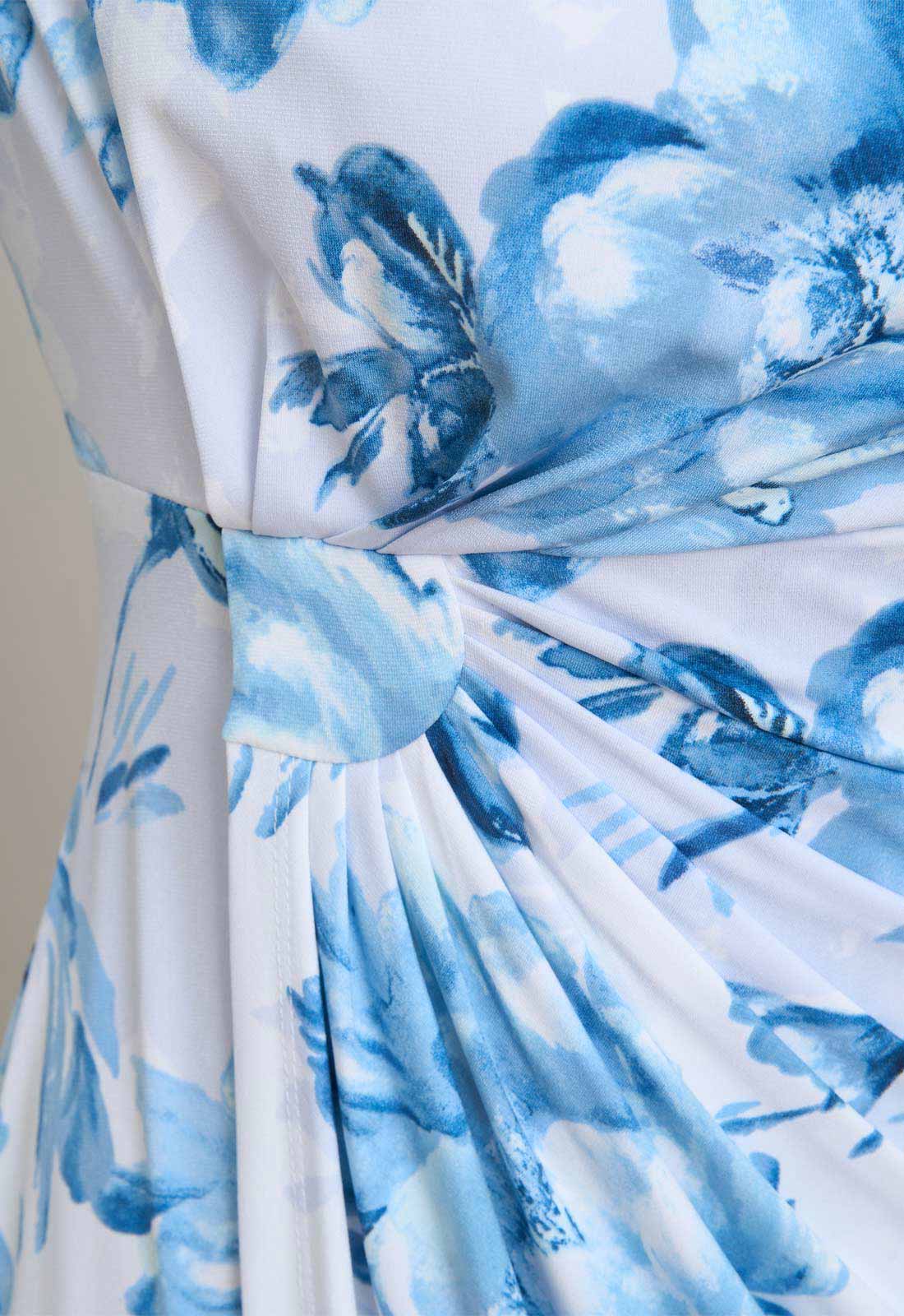 Close-up of a blue floral dress with a white background