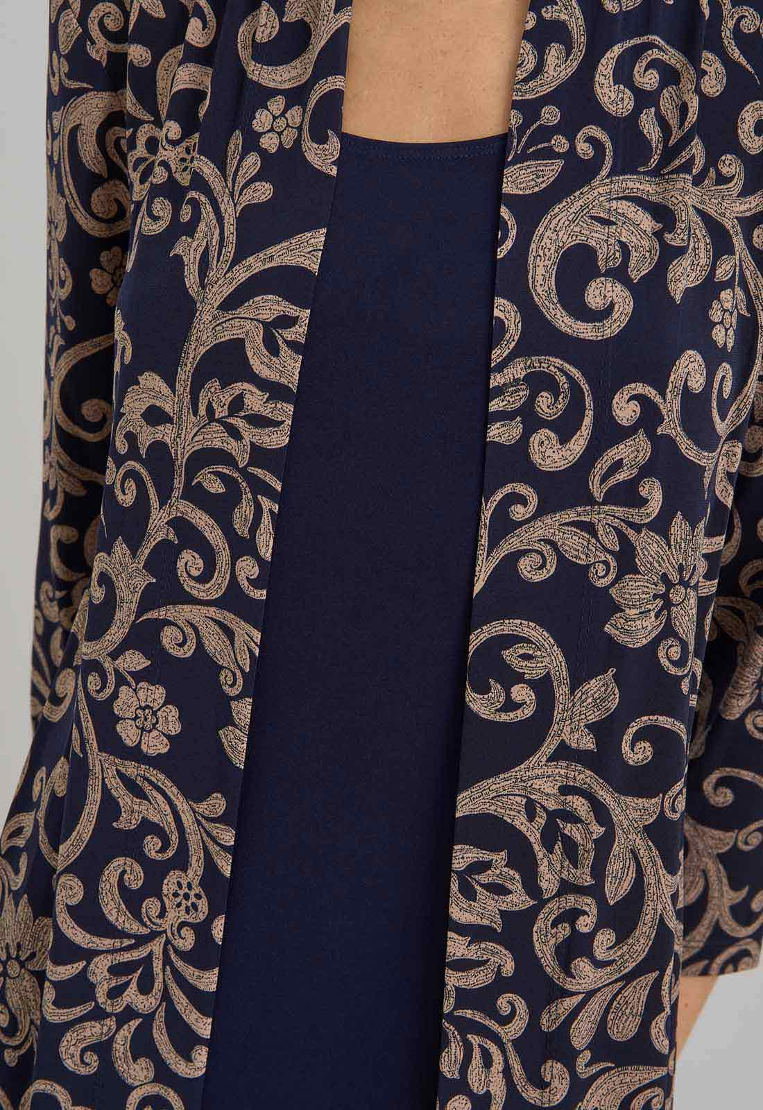 Navy blue dress with gold floral pattern on a plain background