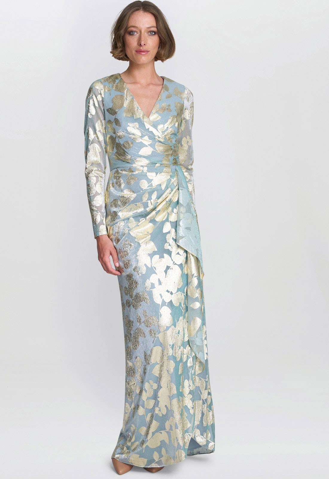 Woman wearing a floral-patterned dress on a white background