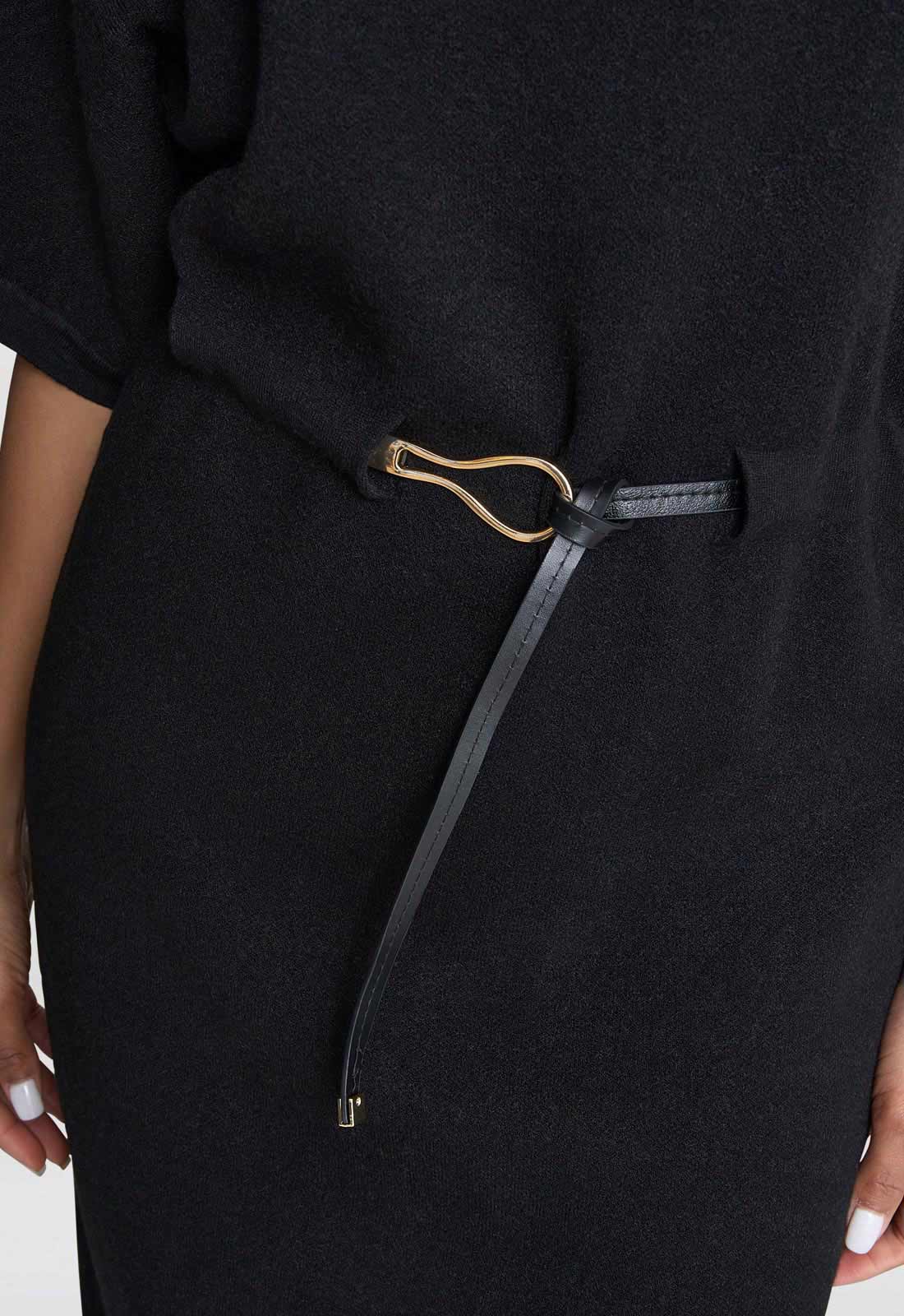 Close-up of a black dress with a drawstring waist.