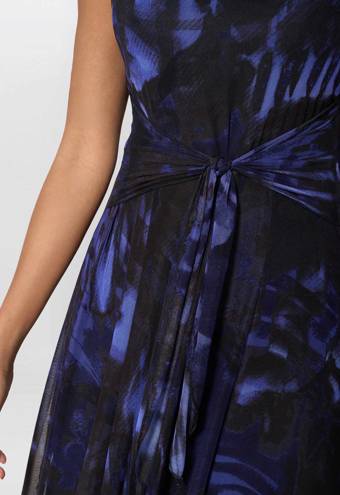 Navy blue floral patterned dress with a tie waist on a white background