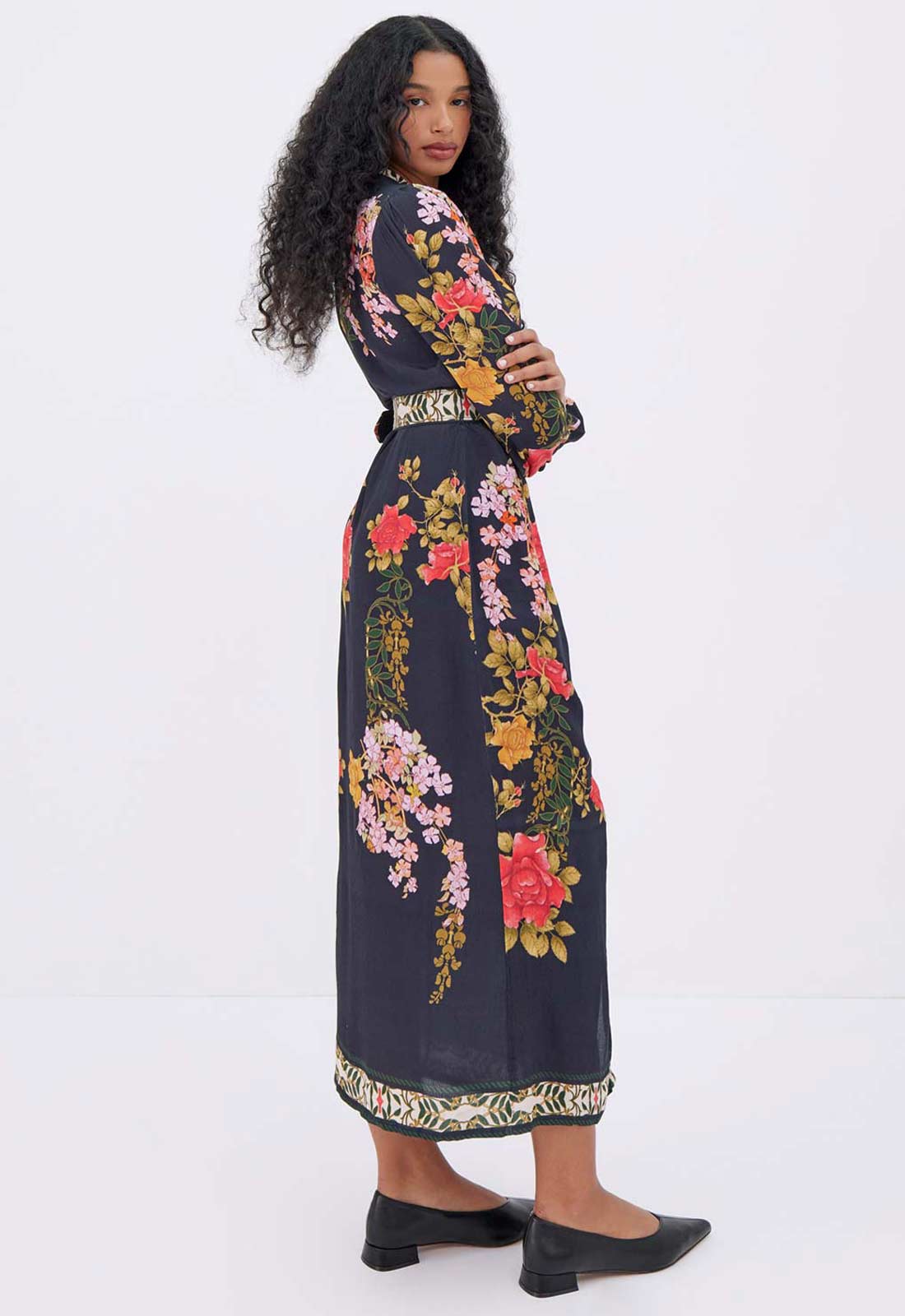 Woman wearing a floral dress with a white background