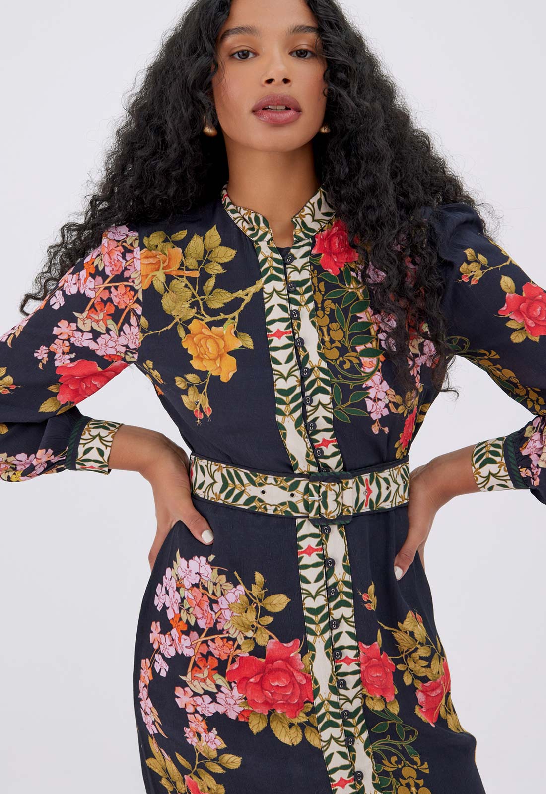 Woman wearing a floral dress with a white background