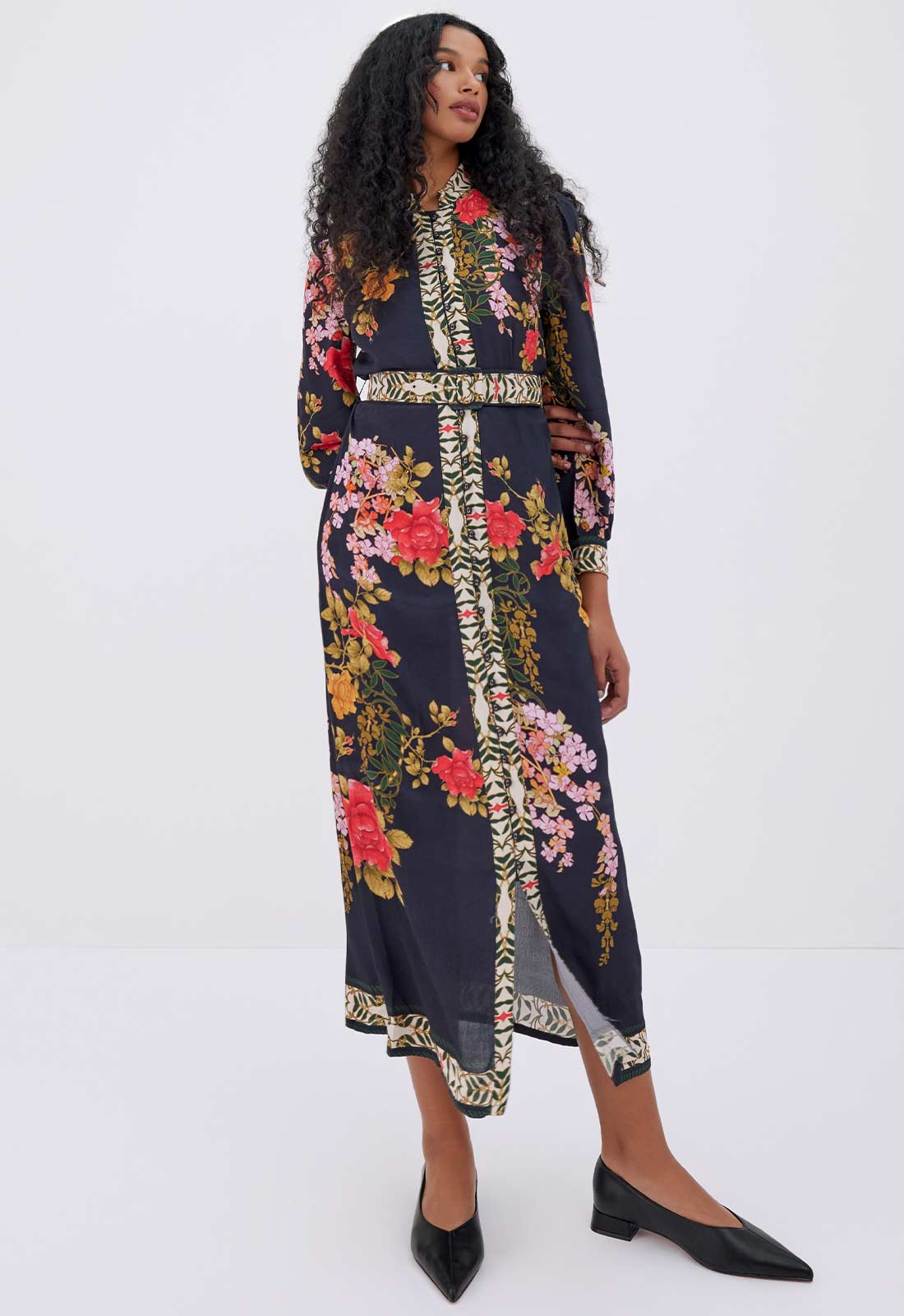 Woman wearing a floral dress with a white background