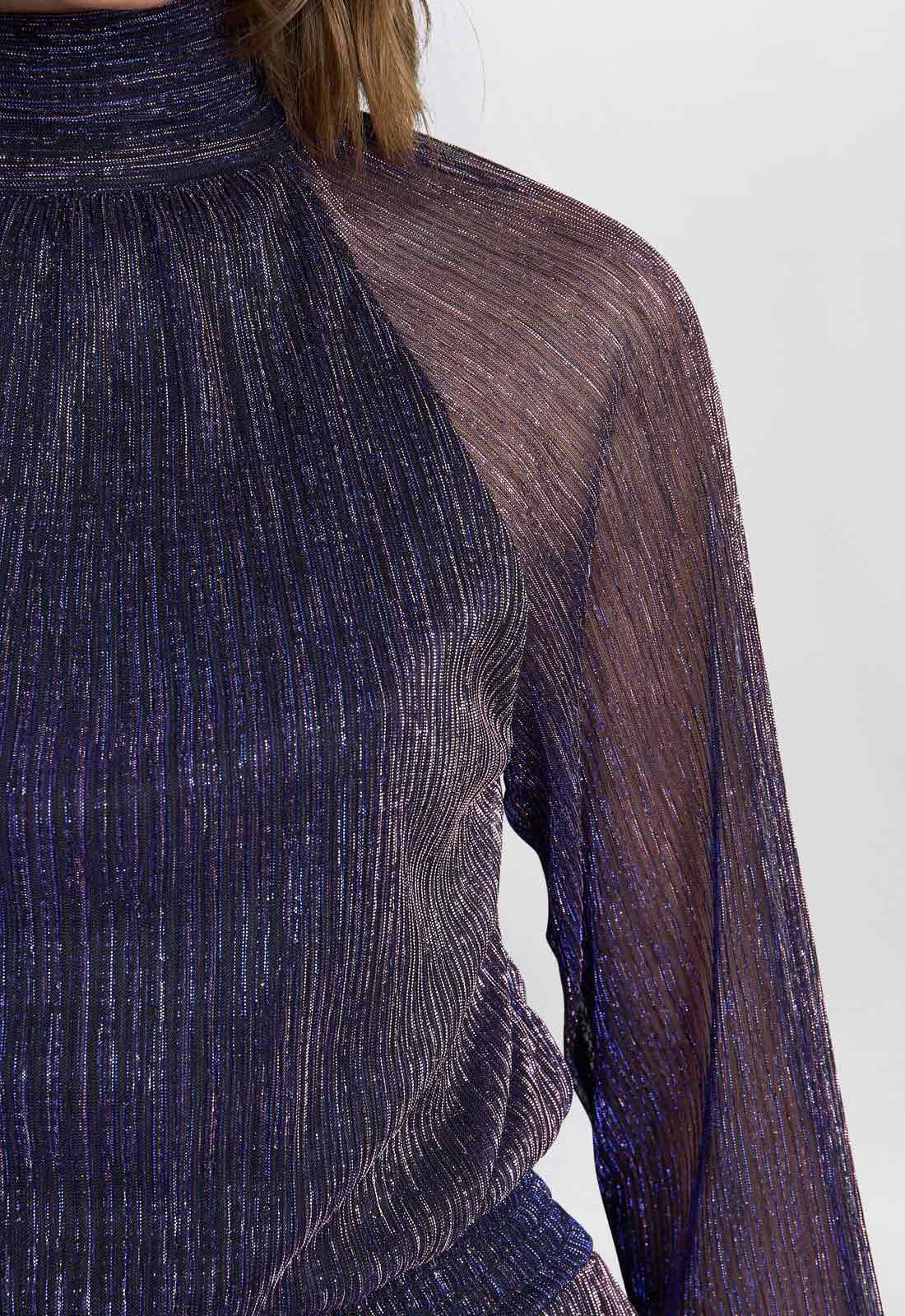 Sheer dark blue long-sleeve top on a white background