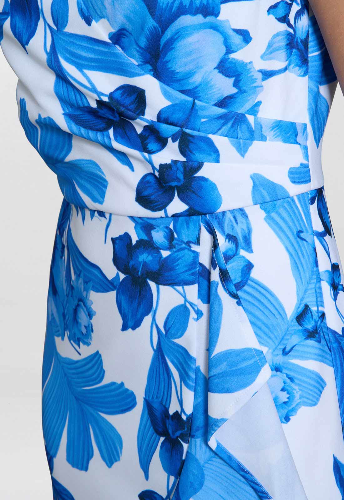 Close-up of a blue floral dress on a white background
