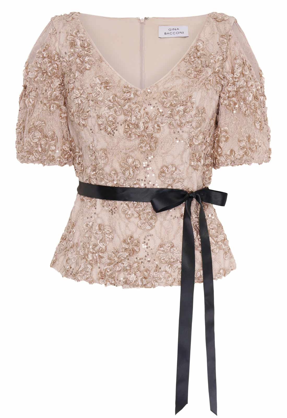 Beige lace top with black ribbon belt on a white background