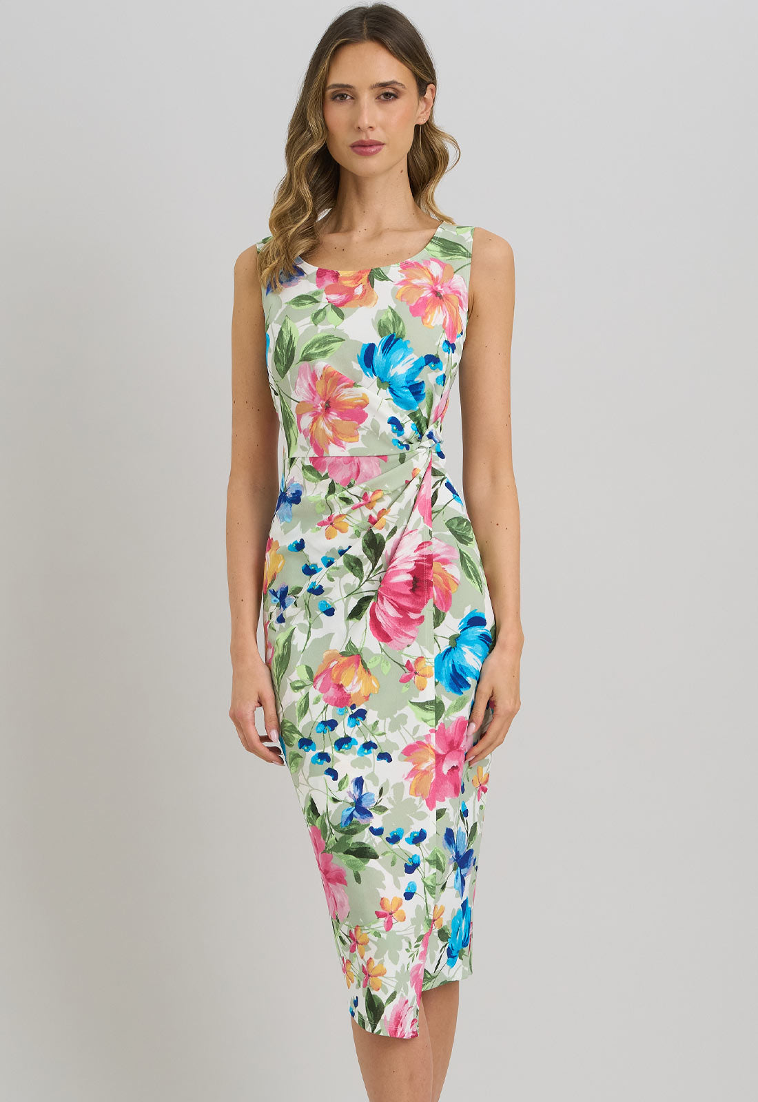 Woman wearing a floral dress on a plain background