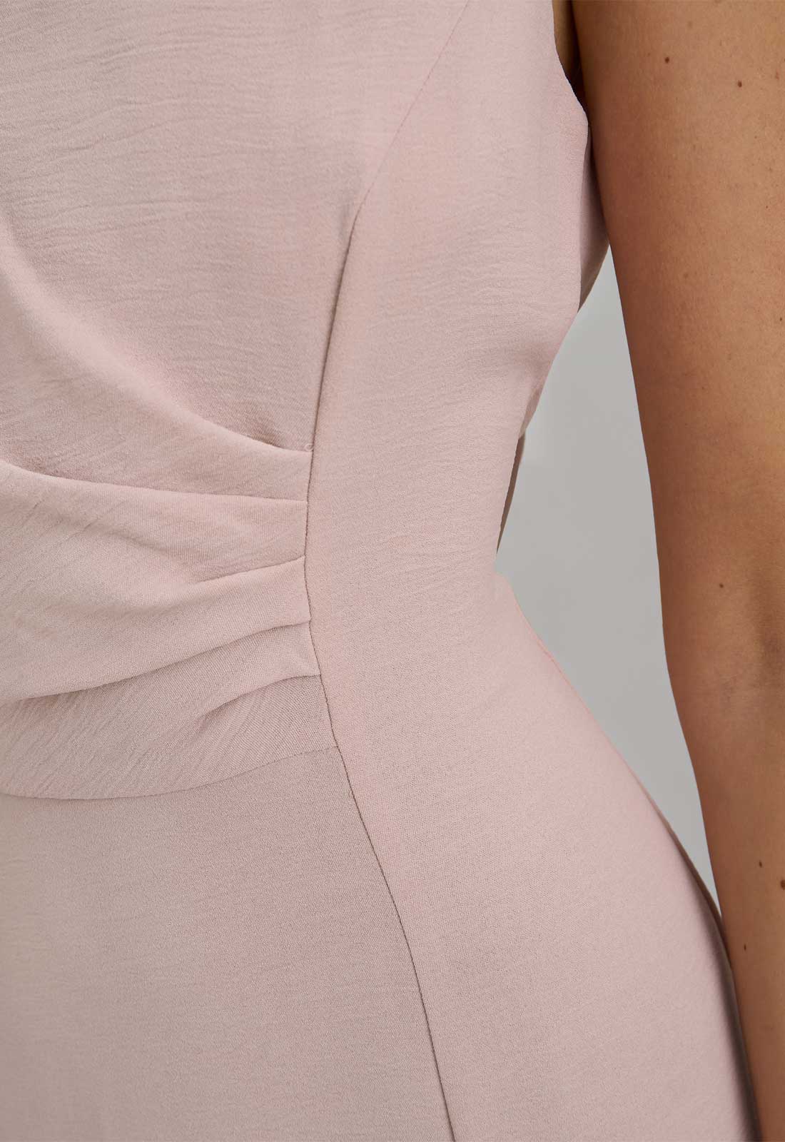 Close-up of a light pink dress with a blurred background
