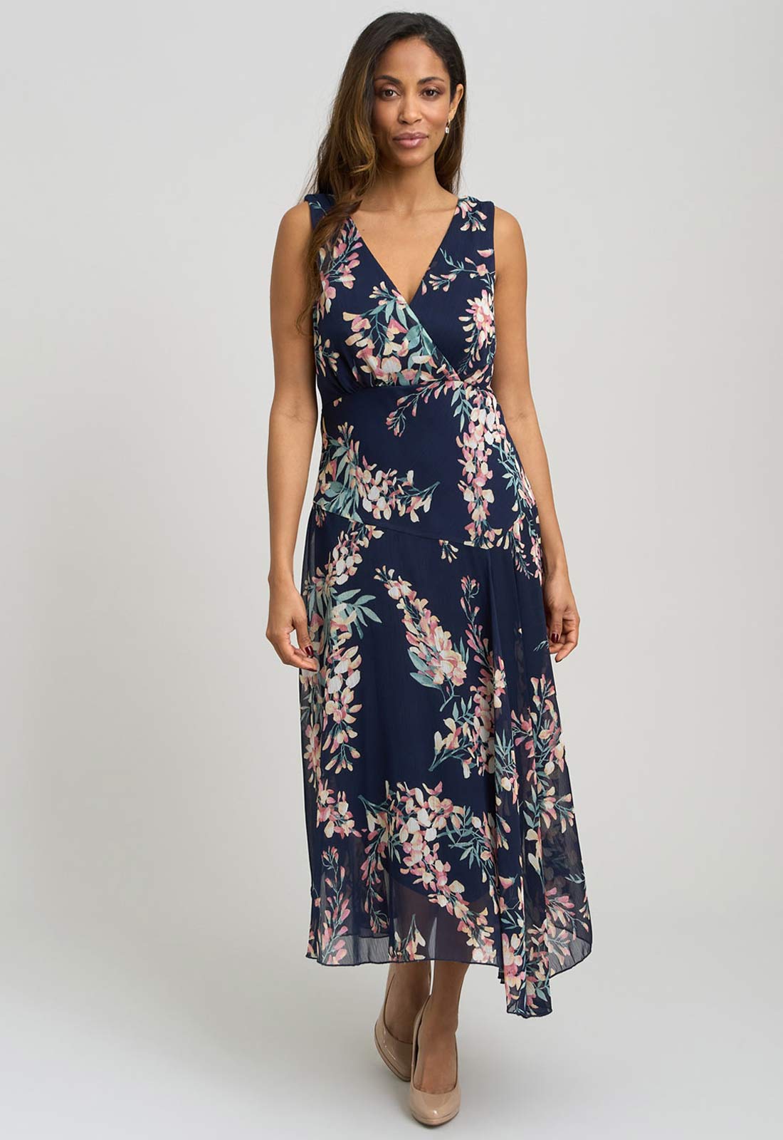 Woman wearing a floral dress on a white background