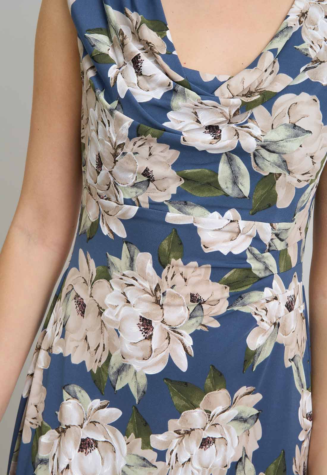Close-up of a floral dress with white flowers on a blue background
