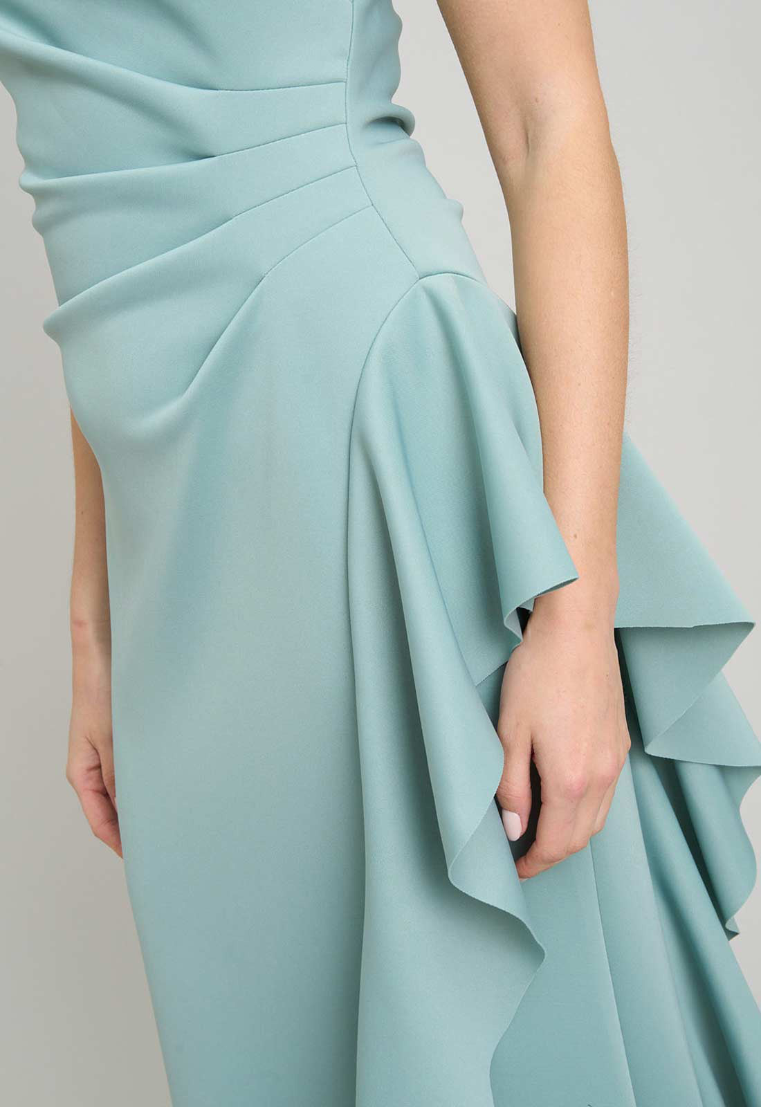 Light blue dress with ruffled details on a plain background