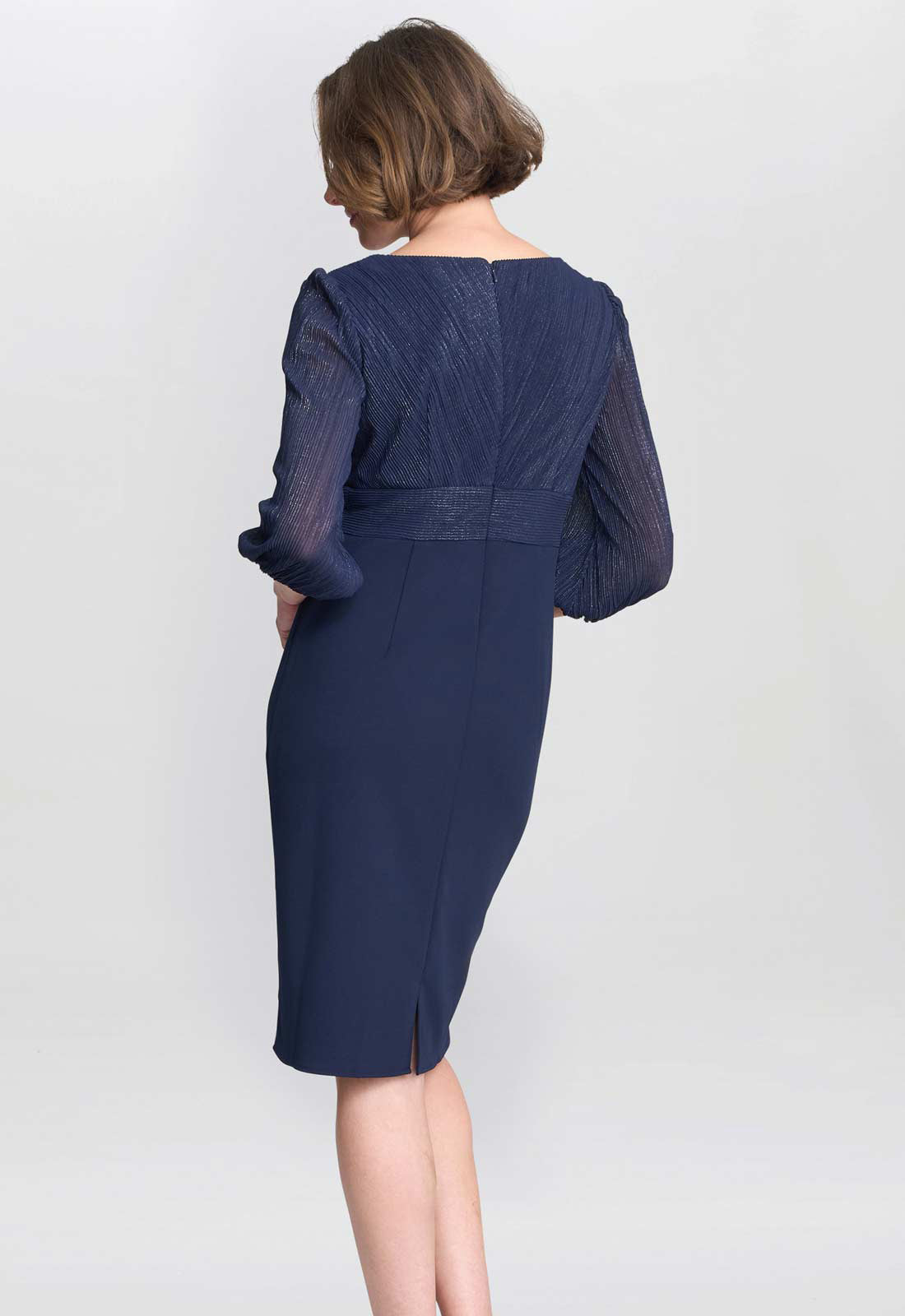 Navy blue dress with sheer sleeves on a white background