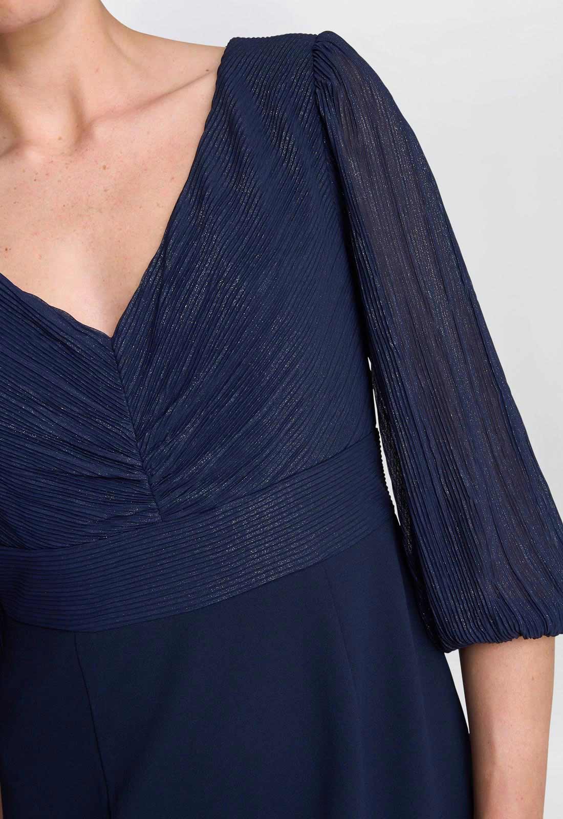 Navy blue dress with a V-neck and short sleeves on a white background