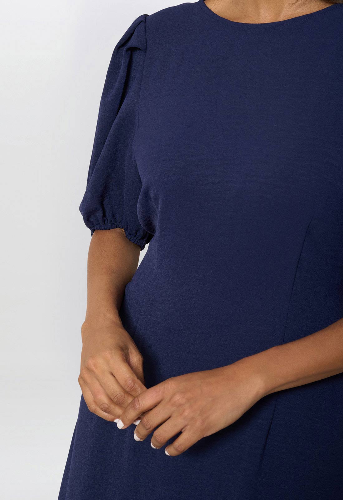 Navy blue dress with puff sleeves on a white background