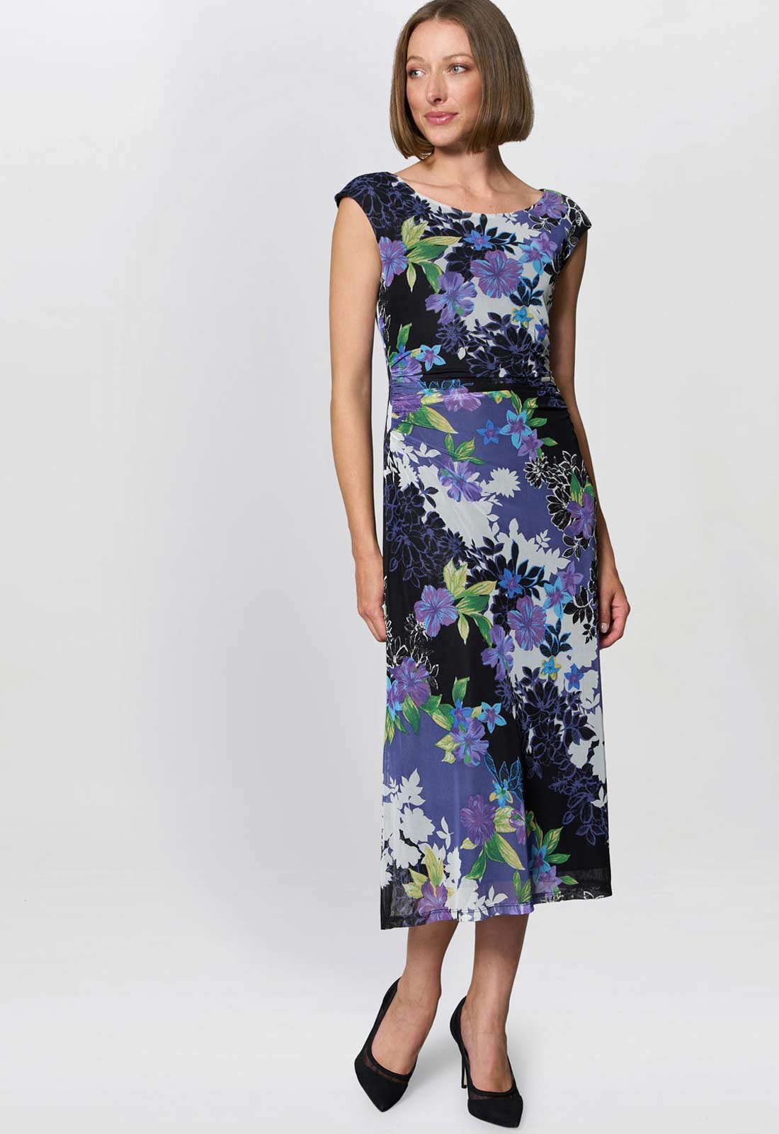 Woman wearing a floral dress on a white background