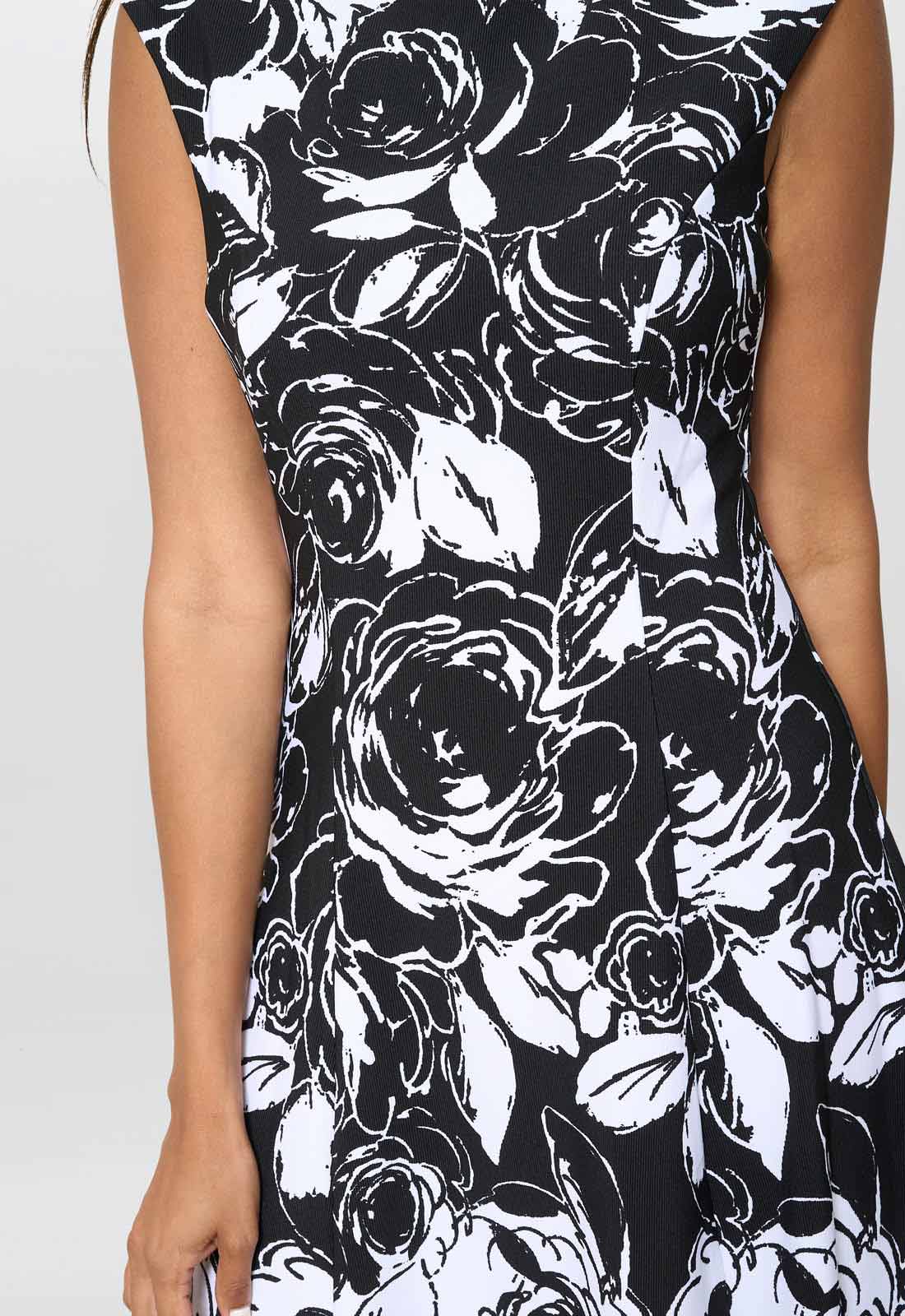 Black and white floral dress on a plain background