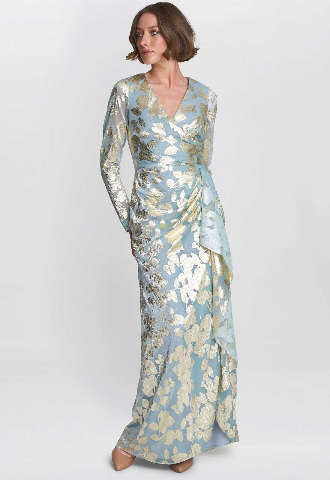 Woman wearing a floral-patterned dress on a white background