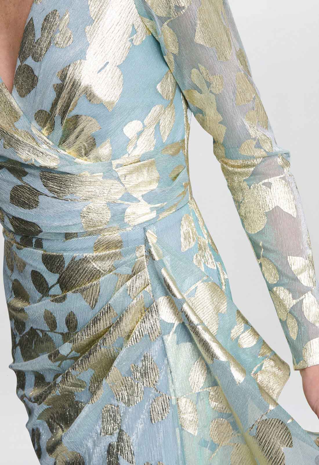 Close-up of a blue fabric with gold leaf pattern